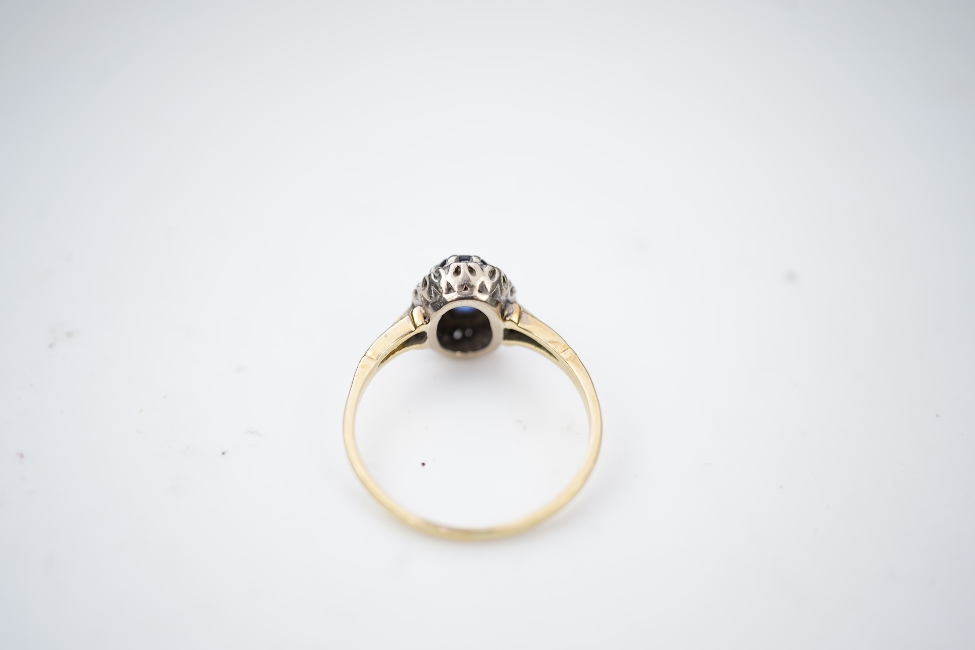 A synthetic sapphire and diamond cluster ring, mid 20th century
